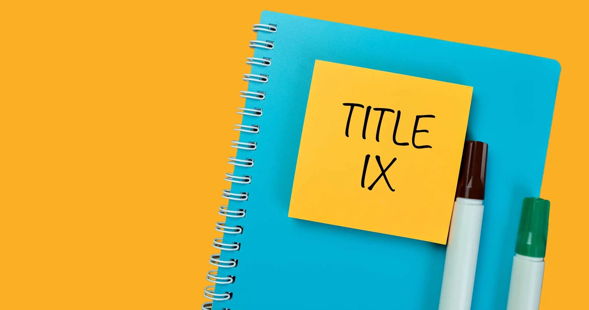 Notebook with a post-it note that says Title IX